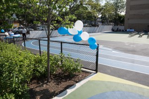 The Edward Bleeker Junior High School now has an artificial turf field that sits on top of a stormwater storage system, trees, porous pavement, and three rain gardens, in addition to new playground equipment and activity areas. (Credit: Tim Schenck)